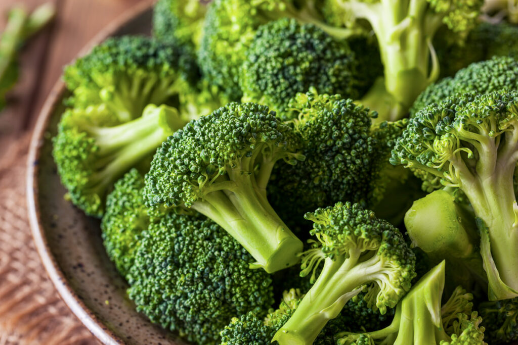 a bowl with raw broccoli florets